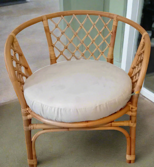 Cane and Wicker/Rattan Bahama Conservatory Chair, with a Cream Faux Suede Seat cushion.